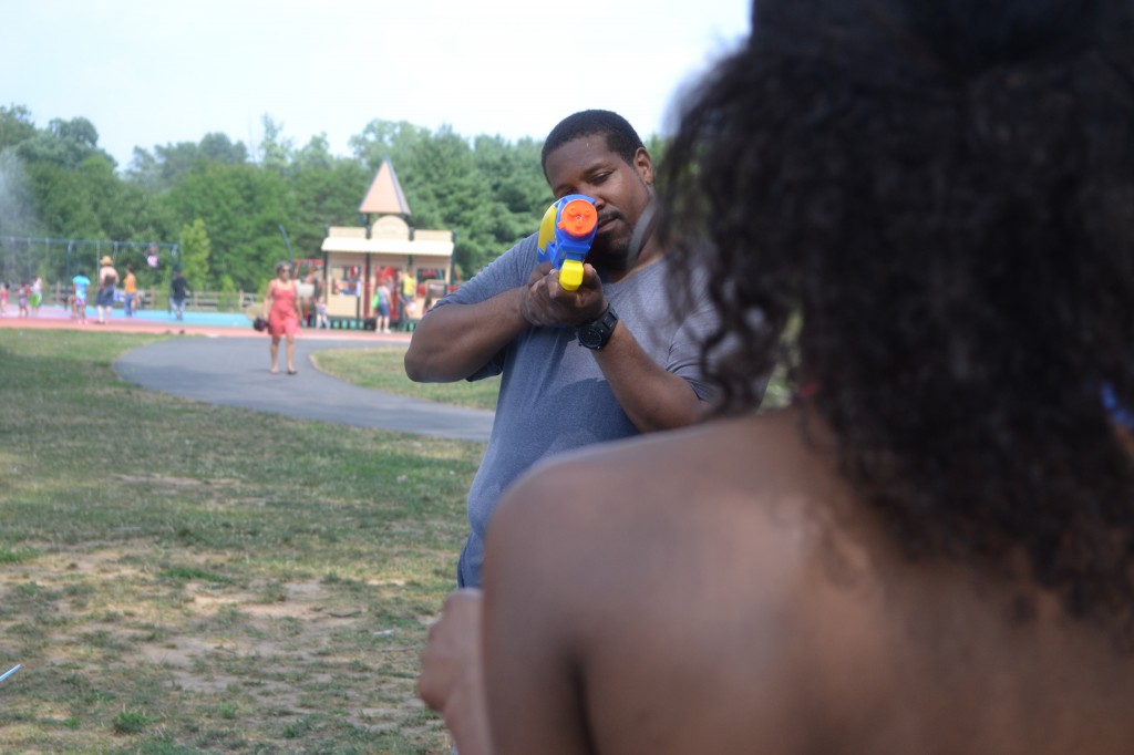 Brother-In-Law sets Sister-In-Law in his water gun sights