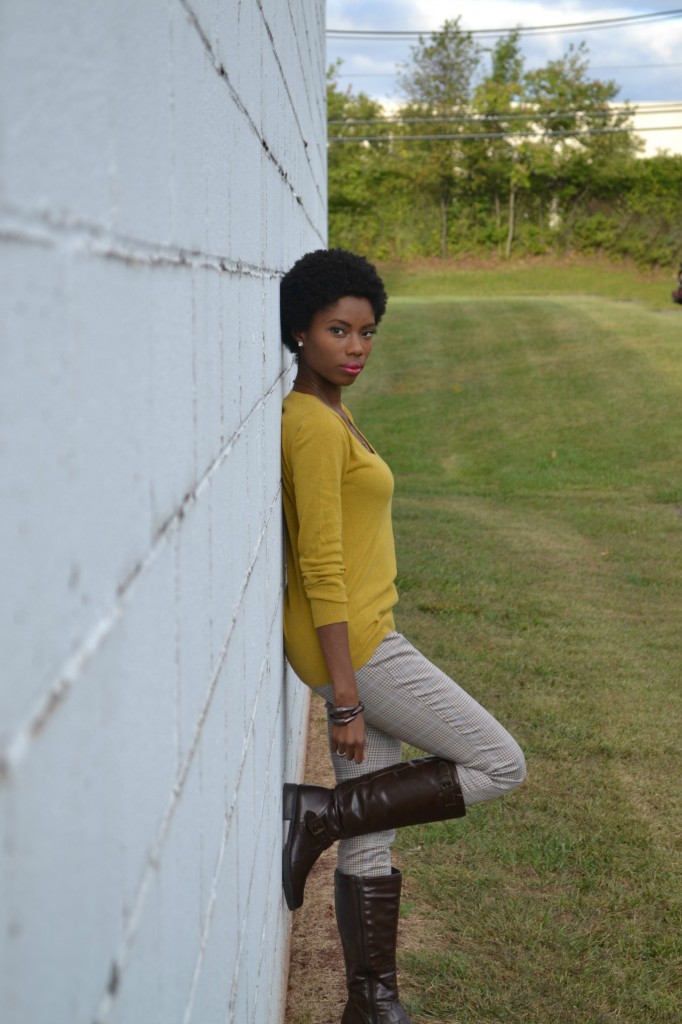 Mustard colored sweater, patterned pants, dark brown knee high boots