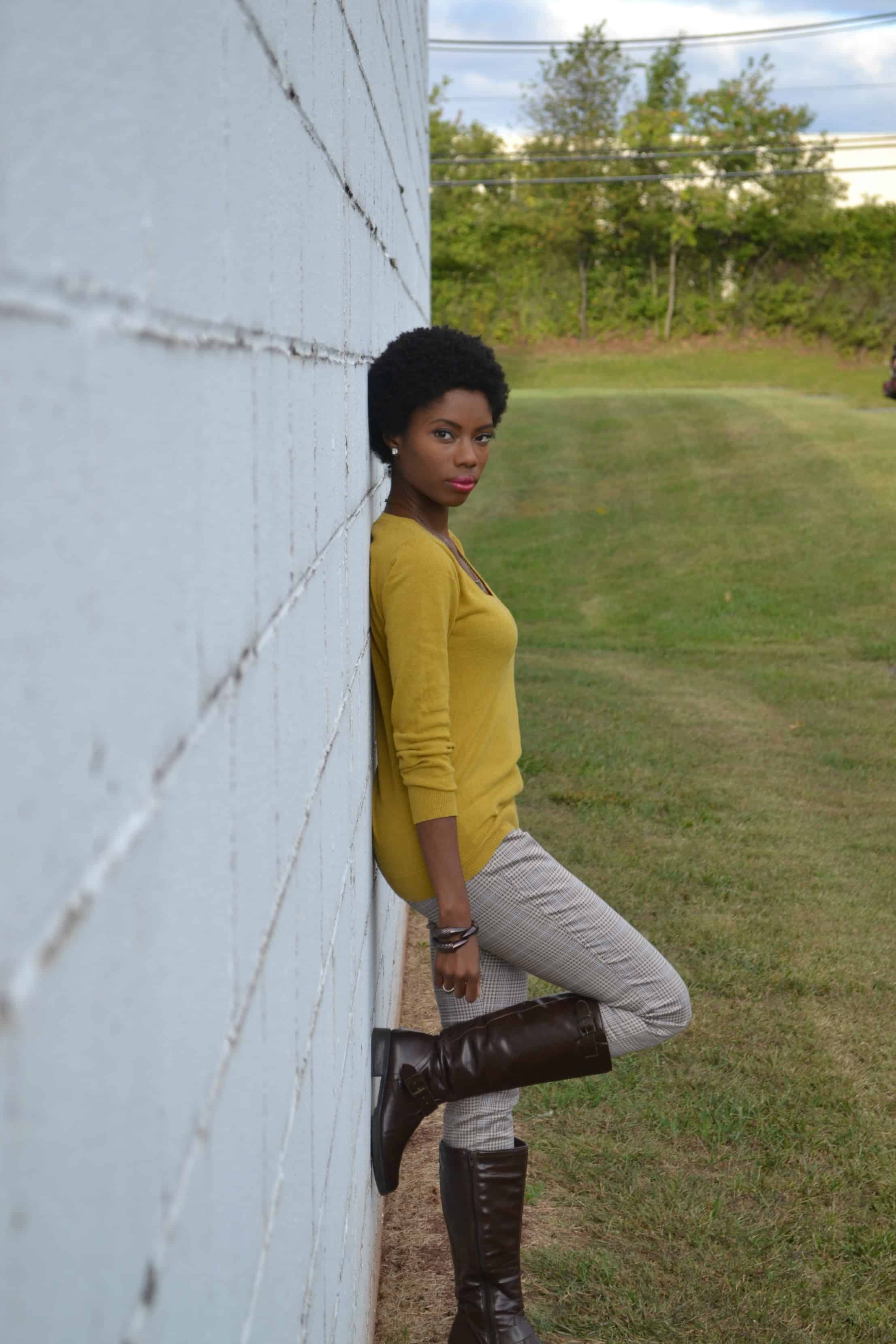 Mustard colored sweater, patterned pants, dark brown knee high boots