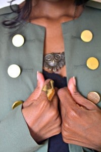 military style jacket with gold detail, gold knuckle ring, owl necklace