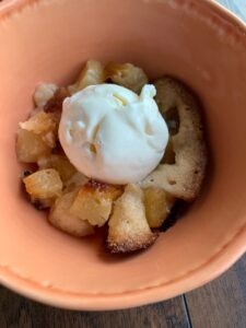 This slow cooker pineapple cobbler recipe is the perfect dessert! It uses cheap pantry ingredients, and can be made in under 3 hours.
